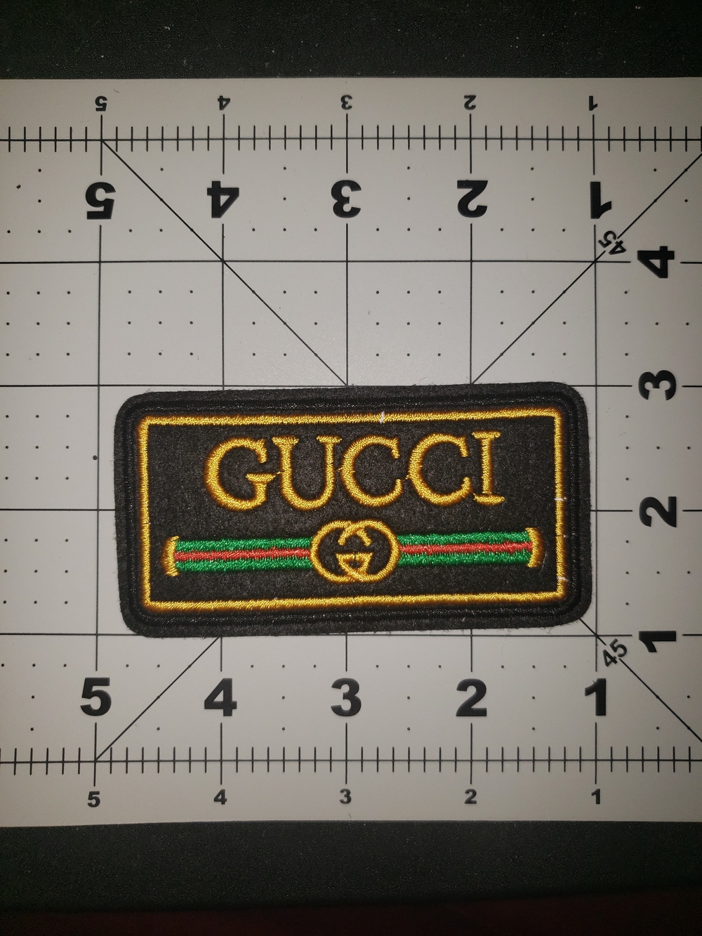 Gucci Black & Gold Embroidered Logo Patch